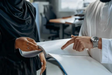 colleagues-standing-woman-abaya-man-600nw-2431519391 colleagues-standing-woman-abaya-man-600nw-2431519391